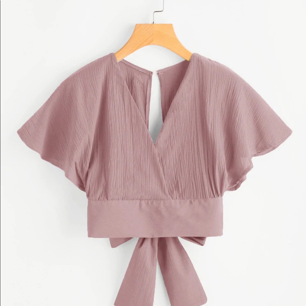 Pink backless crop top with bow